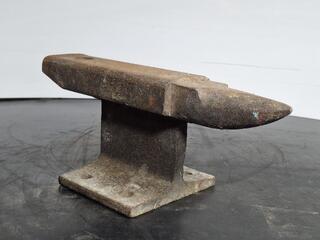 Small steel anvil on base stand